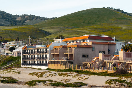 Pismo beach, California, USA-March 2, 2023.  Beachfront Pismo Beach hotels and houses on the hills. Stylish accomadations with ocean viewのeditorial素材