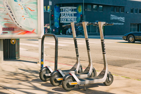 Los Angeles, California, USA - April 26, 2023.   Metro bikes are parked on the sidewalk on sunset boulevard in West Hollywood. Street view, city lifeのeditorial素材