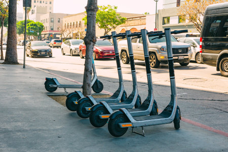 Los Angeles, California, USA - April 26, 2023.   Metro bikes are parked on the sidewalk on sunset boulevard in West Hollywood. Street view, city lifeのeditorial素材
