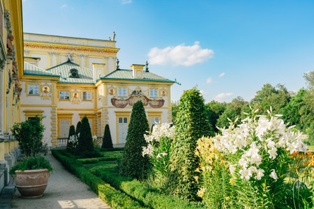 Warsaw, Poland - July 15, 2023. Wilanow Palace in Warsaw, Poland - a baroque royal palace, and beautiful garden with bushes and flowers.のeditorial素材