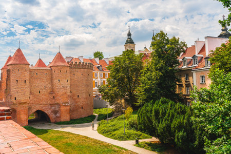 Warsaw, Poland - July 16, 2023. Old Town Warsaw. Towers and red brick walls of the historical Warsaw Barbican fort, Polandのeditorial素材