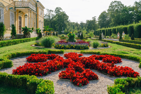 Warsaw, Poland - July 15, 2023. Wilanow Palace in Warsaw, Poland - a baroque royal palace, and beautiful garden with bushes and flowers.のeditorial素材