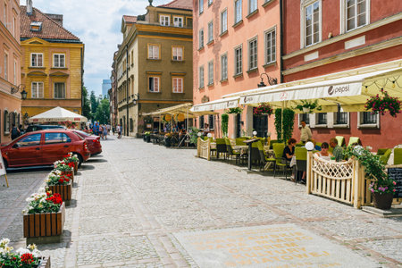 Warsaw, Poland - July 16, 2023. Old Town Market Square in Warsaw is a bustling local gathering place and a symbol of the city's resilienceのeditorial素材