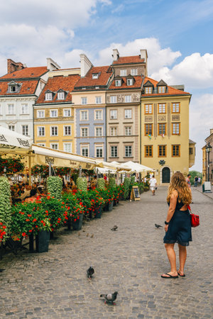 Warsaw, Poland - July 16, 2023. Old Town Market Square in Warsaw is a bustling local gathering place and a symbol of the city's resilienceのeditorial素材