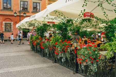 Warsaw, Poland - July 16, 2023. Old Town Market Square in Warsaw is a bustling local gathering place and a symbol of the city's resilienceのeditorial素材