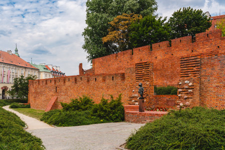 Warsaw, Poland - July 16, 2023. Old Town Warsaw. Towers and red brick walls of the historical Warsaw Barbican fort, Polandのeditorial素材