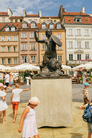 Warsaw, Poland - July 16, 2023. Old Town Market Square with Mermaid Statue - a symbol of the city of Warsaw at the Old Town Market Square, Polandのeditorial素材