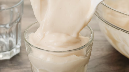 Serving white chocolate vanilla bean pudding in a glass. Perfect deliciously dessertの写真素材