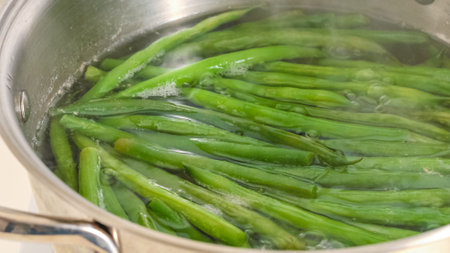 Pan fried French green beans (Haricots Verts) recipe. Boil green beans before sauteing them.の写真素材