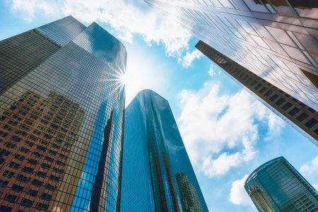 Los Angeles, California, USA - April 25, 2023. Skyscrapers in the downtown city of Los Angeles. Business District. Low-angle view of tall modern buildings with a cloudy sky in the background.のeditorial素材