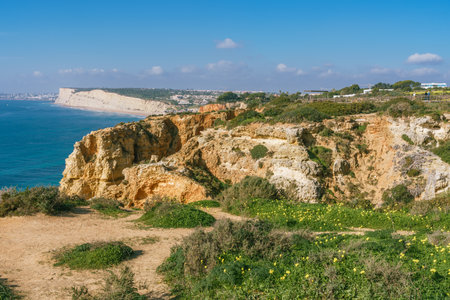 Picturesque cliff walk along the Lagos coastline in Algarve, Portugalの写真素材