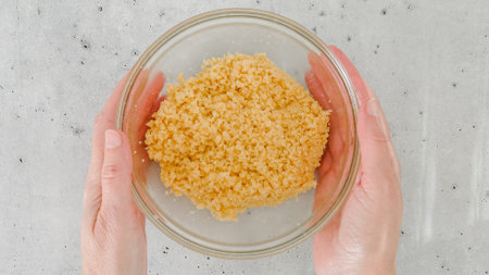 Cracker crust for cheesecake recipe. Mixing crushed crackers with melted butter. Homemade mini...