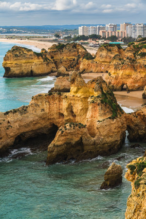 Rocky coastline, Algarve, Portugal, vertical bannerの写真素材