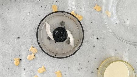 Cracker crust for cheesecake recipe. Homemade mini cheesecakes preparation process, close-up ingredientsの写真素材