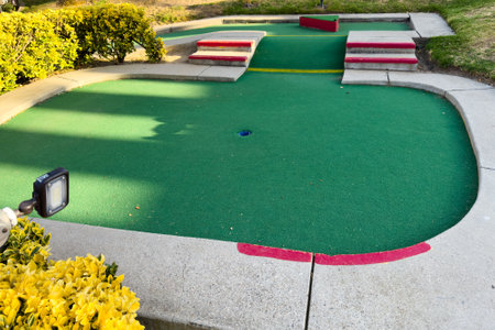 Colorful mini-golf course features various holes and playful challenges.の写真素材