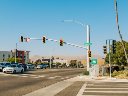 Santa Maria, California, USA - July 20, 2024. Intersection with traffic lights and California 101 North South sign under a clear blue sky.のeditorial素材