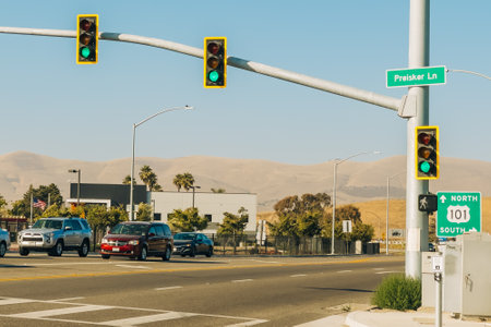 Santa Maria, California, USA - July 20, 2024. Cars wait at a red light with a California 101 North South sign at a busy intersection.のeditorial素材