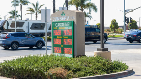 Santa Maria, California, USA - July 21, 2024. Gas station sign displaying fuel prices.のeditorial素材
