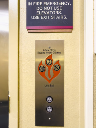 Santa Maria, California, USA - July 21, 2024. Elevator control panel advising not to use elevators in case of fire.のeditorial素材