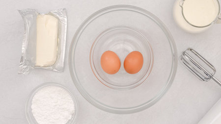 Cream cheese whipped cream recipe. Ingredients close-up on a kitchen table, baking processの写真素材