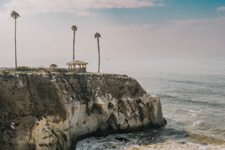 Gazebo on a cliff top, and beautiful Pacific ocean with cloudy sky in the background, California Central Coastの写真素材