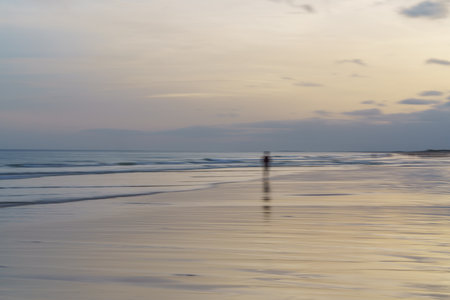Dreamy beach scene capturing motion in the fading light.の写真素材
