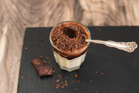 White chocolate vanilla bean pudding served with rich dark chocolate close-upの写真素材