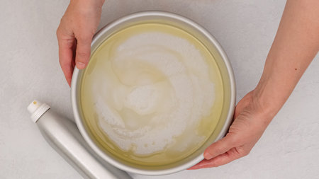 Baking pan coated with a sheen of glistening oil, baking processの写真素材
