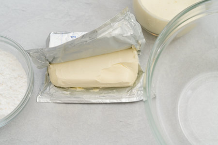 Cream cheese whipped cream recipe. Ingredients close-up on a kitchen table, baking processの写真素材