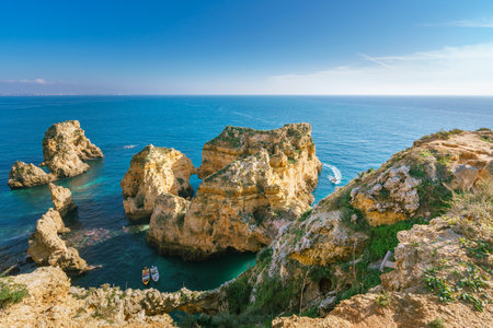 Incredible cliffs and rocks in Lagos, Algarve, Portugal in a bright sunny day.の写真素材