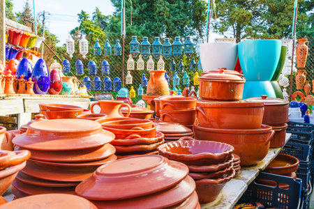 Glossy terracotta dishes showcase traditional craftsmanship and utility.の写真素材