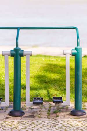 Public exercise machine in a park designed for outdoor fitness and recreation.の写真素材