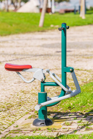 Public exercise machine in a park designed for outdoor fitness and recreation.の写真素材