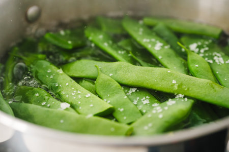 Green beans simmering with salt in hot water.の写真素材