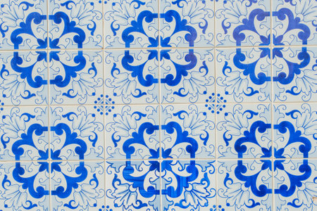 Traditional Portuguese azulejo tiles featuring an intricate blue and white floral pattern.の写真素材