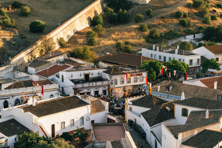 Historic Castro Marim Castle looms above festivalgoers during the annual medieval celebration.の写真素材