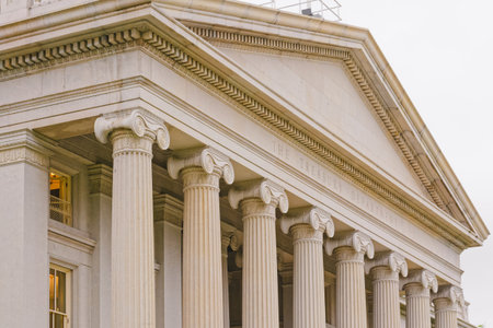 Elegant Corinthian columns and intricate stonework define the grand facade of the U.S. Treasury Department in Washington, D.C.の写真素材