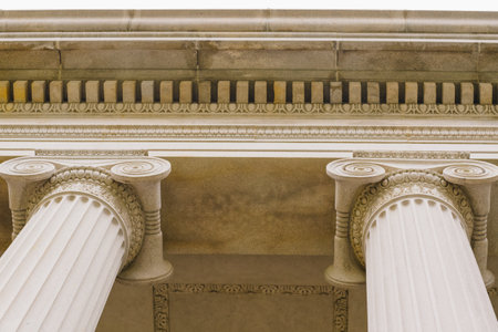 Elegant Corinthian columns and intricate stonework define the grand facade of the U.S. Treasury Department in Washington, D.C.の写真素材