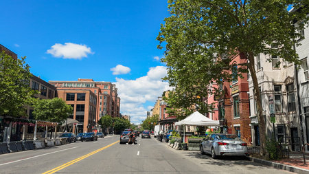 Washington D.C., USA, May 24, 2025. Cars and pedestrians move along U Street NW surrounded by restaurants, historic buildings, and greenery on a bright day.のeditorial素材