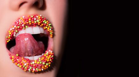 Sweet mouth. Womens tongue in the mouth. Seductive woman close. Sweet lips.の写真素材