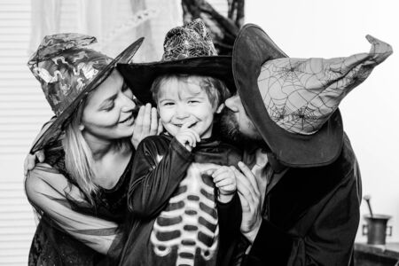 Autumn family love. Traditions for October 31. Mother, son and father celebrate Halloween. Holiday for Toddler. Happy family and vacation concept.の写真素材