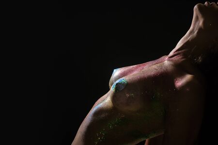 Sexy girl. Woman body. Party concept. Pleasure, beauty and youth. Shiny skin.の写真素材