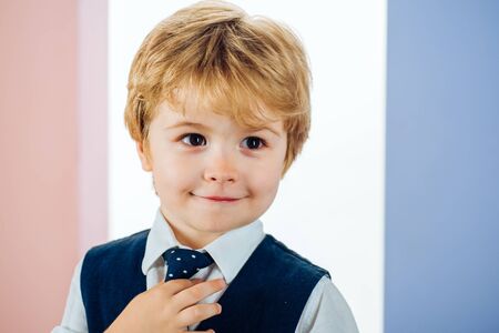 Schoolboy portrait. Junior School. Primary School. Handsome boy in business uniform with a tie.の写真素材