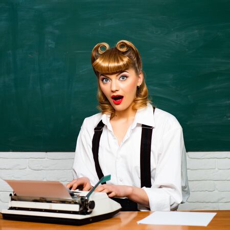 Girl with a typewriter. Quarantine. Work from home.の写真素材