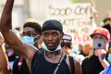 Miami Downtown, FL, USA - MAY 31, 2020: Black man protesting against racism.のeditorial素材