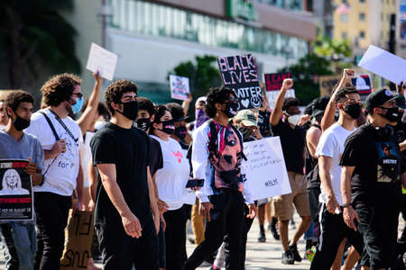 Miami Downtown, FL, USA - MAY 31, 2020: Black Lives Matter. Many american people went to peaceful protests in the US against the George Floyd death: people are protesting. White and black together.のeditorial素材