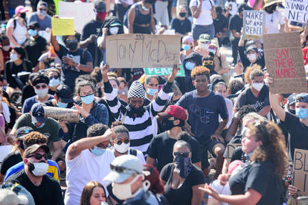 Miami Downtown, FL, USA - MAY 31, 2020: Protesters took to the streets in cities across the U.S. after a white police officer was charged with the murder of an unarmed black man.のeditorial素材