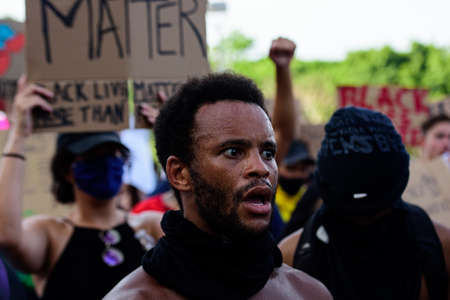 Miami Downtown, FL, USA - MAY 31, 2020: Black Lives Matter. Many american people went to peaceful protests in the US against the George Floyd death: people are protesting. White and black together.のeditorial素材