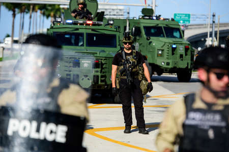 Miami Downtown, FL, USA - MAY 31, 2020: Police officers with weapons in the streets of Miami.のeditorial素材