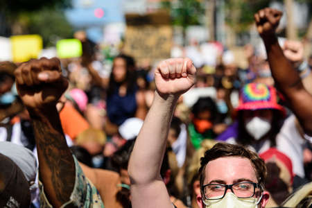 Miami Downtown, FL, USA - MAY 31, 2020: A white man with glasses and a mask takes part in a protest against racism in the US.のeditorial素材